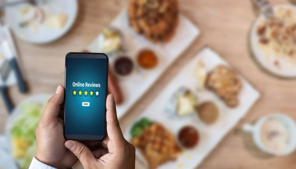 Person leaving review of food image